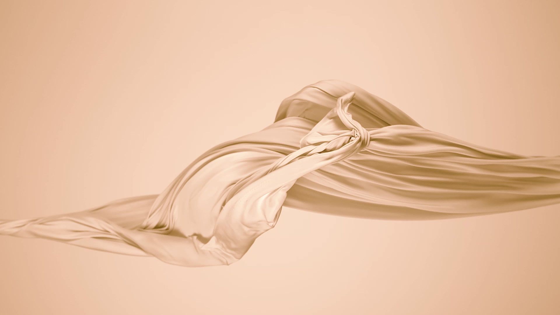 Soft folds of fabric in warm neutral tones