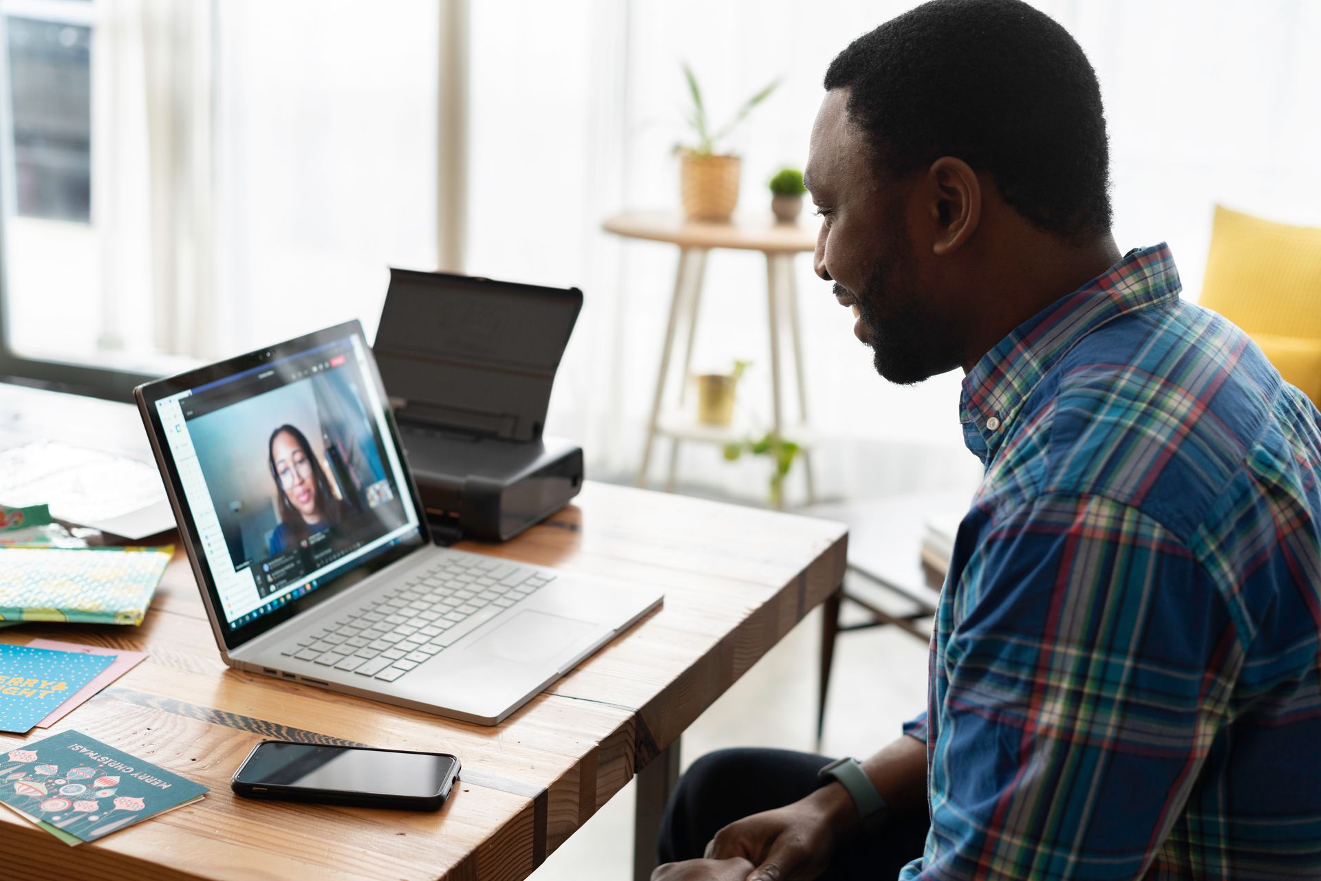 A man in an online consultation at a desk